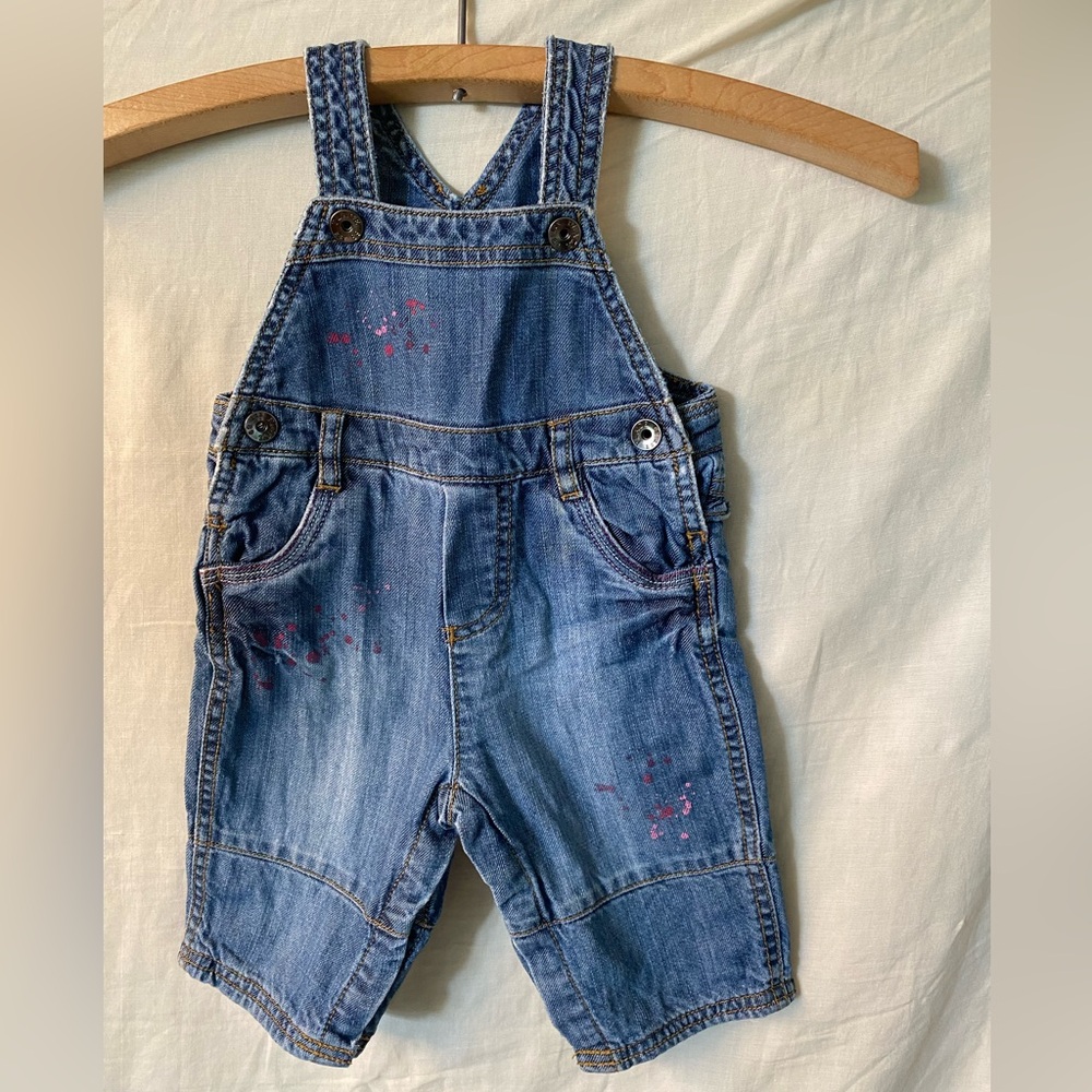 Blue Denim Overalls with Pink Paint Splatters and Heart Ruffle Details on Back